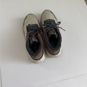 On Running Women's Beige and Brown Trail Sneakers with Black Accents